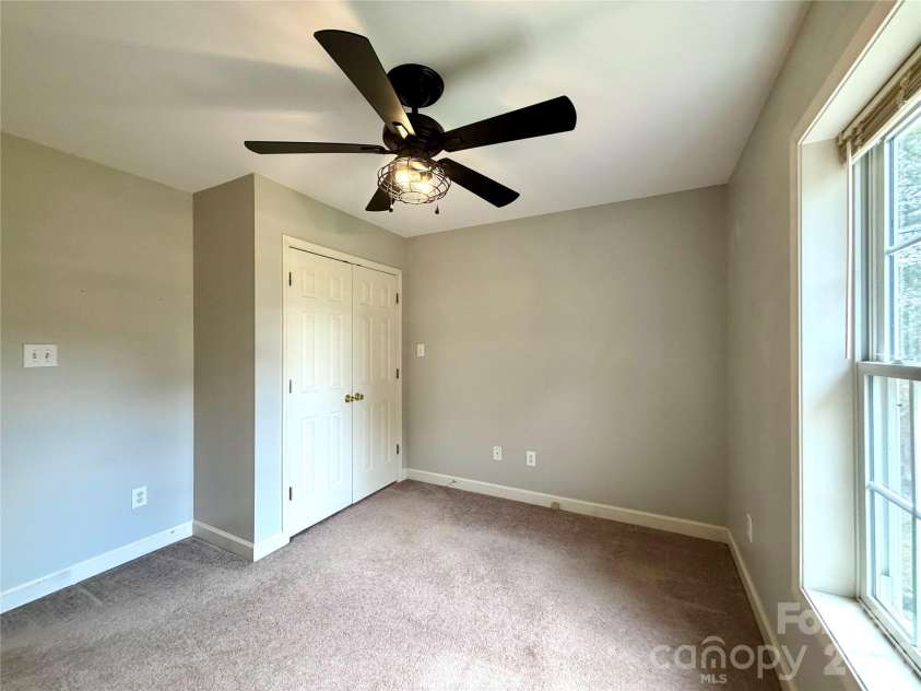 1027 Tabor Road, Olin, NC 28660.  MLS# CAR4399762, YatesRealty ID 35295. Rear bedroom