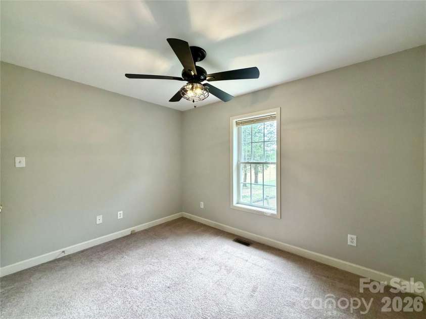 1027 Tabor Road, Olin, NC 28660.  MLS# CAR4399762, YatesRealty ID 35295. Rear bedroom