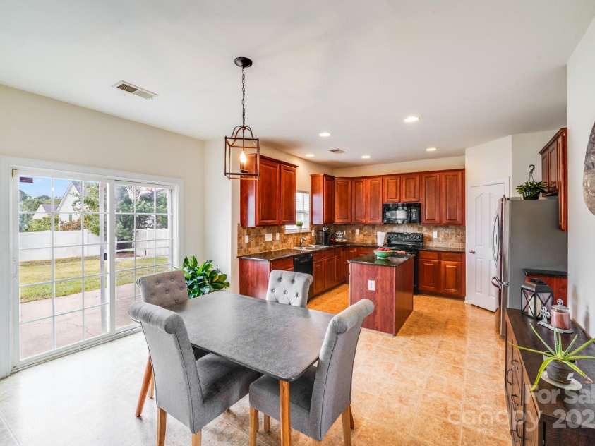 497 Dockside Lane, Concord, NC 28027.  MLS# CAR4288072, YatesRealty ID 35295. Dining Area + Kitchen