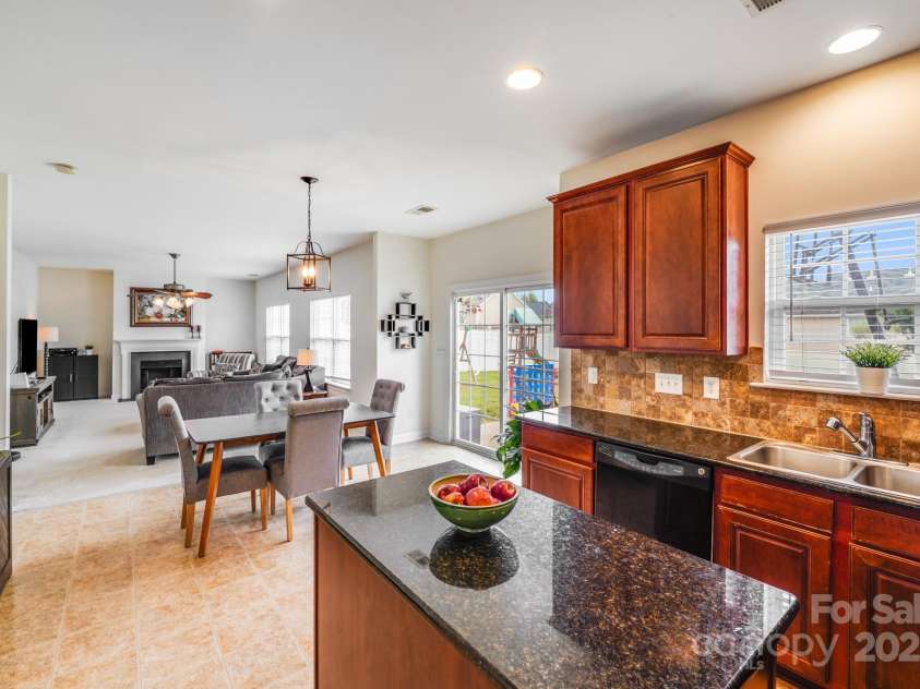 497 Dockside Lane, Concord, NC 28027.  MLS# CAR4288072, YatesRealty ID 35295. Living Room view from kitchen