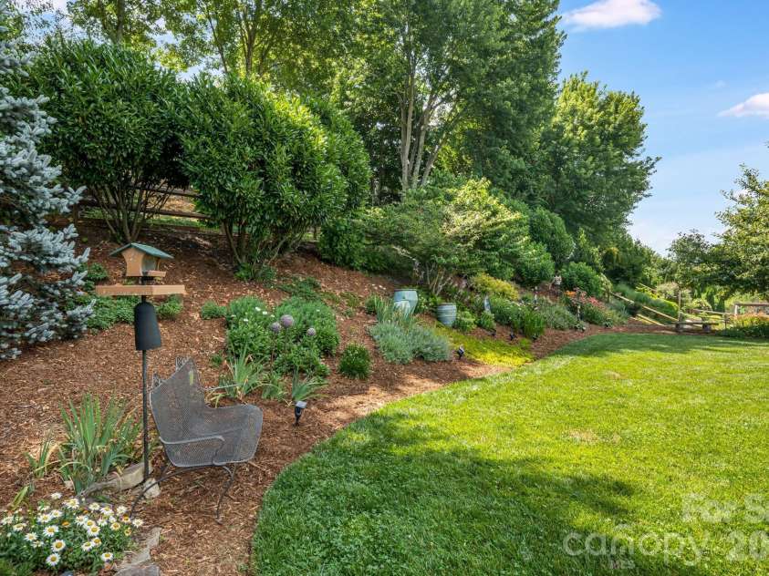 60 Barnrock Drive, Mills River, NC 28759.  MLS# CAR4399294, YatesRealty ID 35309. Beautifully landscaped back yard!