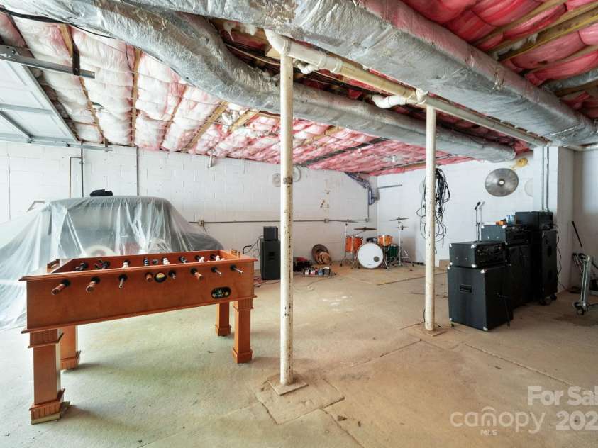 207 Jonestown Road, Asheville, NC 28804.  MLS# CAR4282927, YatesRealty ID 35316. Garage under main house