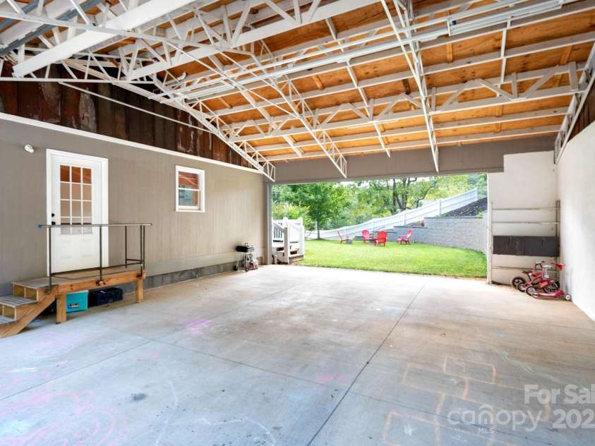 207 Jonestown Road, Asheville, NC 28804.  MLS# CAR4282927, YatesRealty ID 35316. Leads to large level backyard
