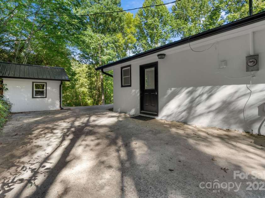 164 Pigeon Lane, Sylva, NC 28779.  MLS# CAR4295317, YatesRealty ID 35317. Back of the Home