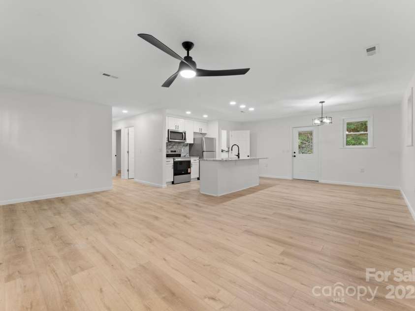 164 Pigeon Lane, Sylva, NC 28779.  MLS# CAR4295317, YatesRealty ID 35317. Livingroom and Kitchen