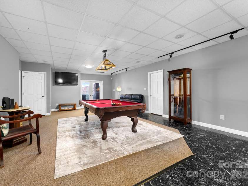 825 Ed Hamrick Road, Shelby, NC 28150.  MLS# CAR4239621, YatesRealty ID 3533. Glass doors lead directly to the outdoor patios and pickle ball court.