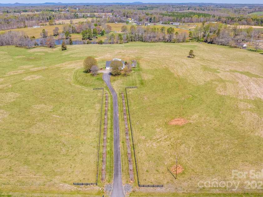 825 Ed Hamrick Road, Shelby, NC 28150.  MLS# CAR4239621, YatesRealty ID 3533. Incredible mountain views, rolling pastures and pond.