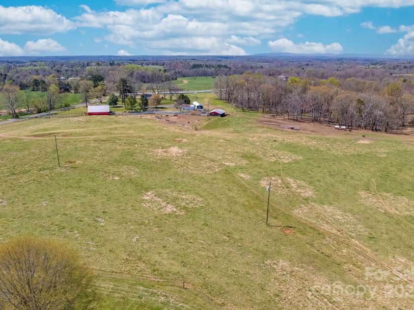 825 Ed Hamrick Road, Shelby, NC 28150.  MLS# CAR4239621, YatesRealty ID 3533. The two red barns are included in the 73+ acres MLS #4234409