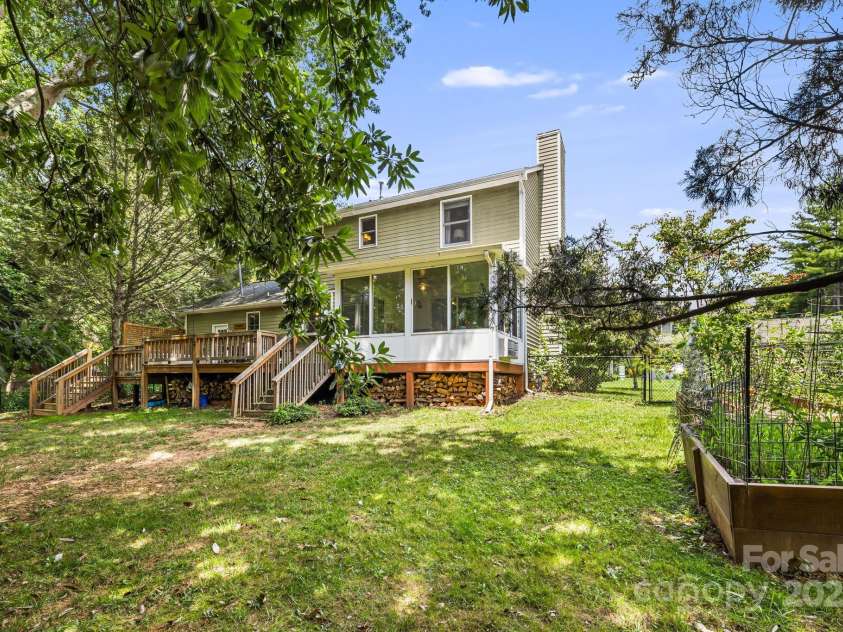 3 Trappers Run Drive, Asheville, NC 28805.  MLS# CAR4286329, YatesRealty ID 35345. Back yard and raised garden beds