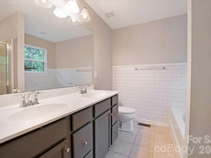 278 Almora Loop, Mooresville, NC 28115.  MLS# CAR4390826, YatesRealty ID 35356. Bathroom off primary bedroom