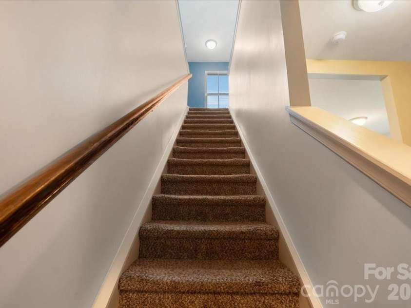 278 Almora Loop, Mooresville, NC 28115.  MLS# CAR4390826, YatesRealty ID 35356. Stairs to upper level