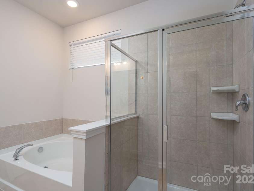6023 Walkers Run Drive, Monroe, NC 28110.  MLS# CAR4292424, YatesRealty ID 35358. Primary Bathroom