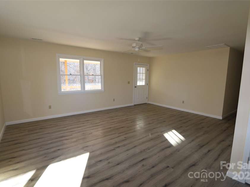 249 Cherry Hollow Road, Burnsville, NC 28714.  MLS# CAR4322750, YatesRealty ID 3536. Living Room- View 2.