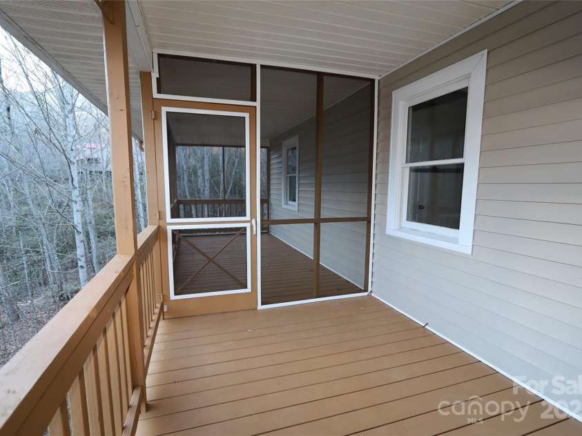249 Cherry Hollow Road, Burnsville, NC 28714.  MLS# CAR4322750, YatesRealty ID 3536. Screened Porch for Relaxing Summer Evenings.