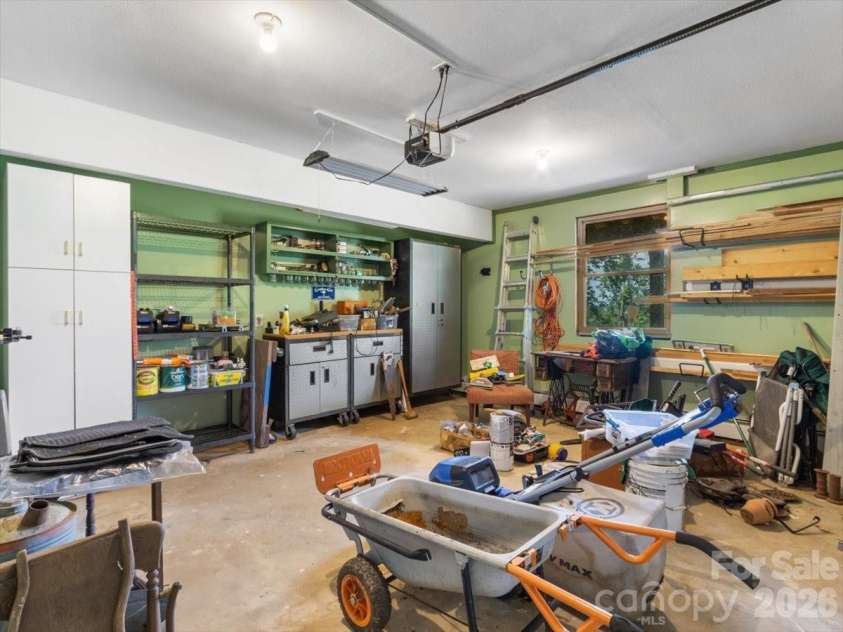 1355 Moonshine Mountain Road, Burnsville, NC 28714.  MLS# CAR4400046, YatesRealty ID 35360. Heated garage workspace