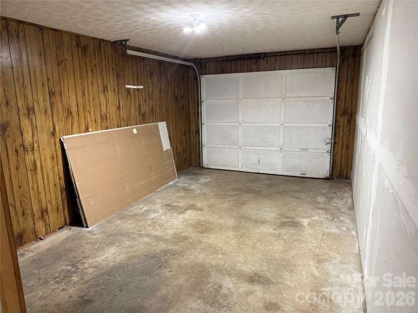 32 Mayfair Drive, Candler, NC 28715.  MLS# CAR4392323, YatesRealty ID 35365. Attached garage