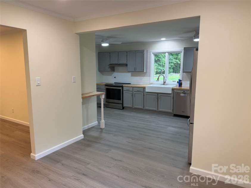 32 Mayfair Drive, Candler, NC 28715.  MLS# CAR4392323, YatesRealty ID 35365. Dining off kitchen and living room.