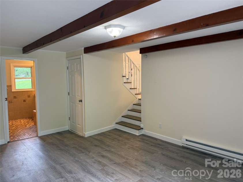 32 Mayfair Drive, Candler, NC 28715.  MLS# CAR4392323, YatesRealty ID 35365. Lower level family room