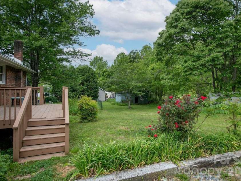 100 Kilpatrick Street, Brevard, NC 28712.  MLS# CAR4382761, YatesRealty ID 35369. Backyard and porch