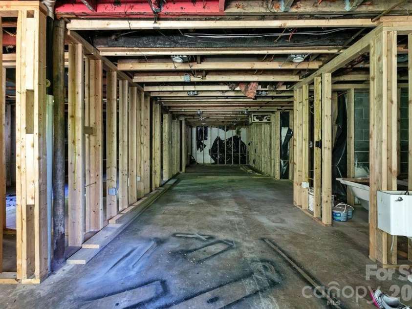 100 Kilpatrick Street, Brevard, NC 28712.  MLS# CAR4382761, YatesRealty ID 35369. Basement with framing