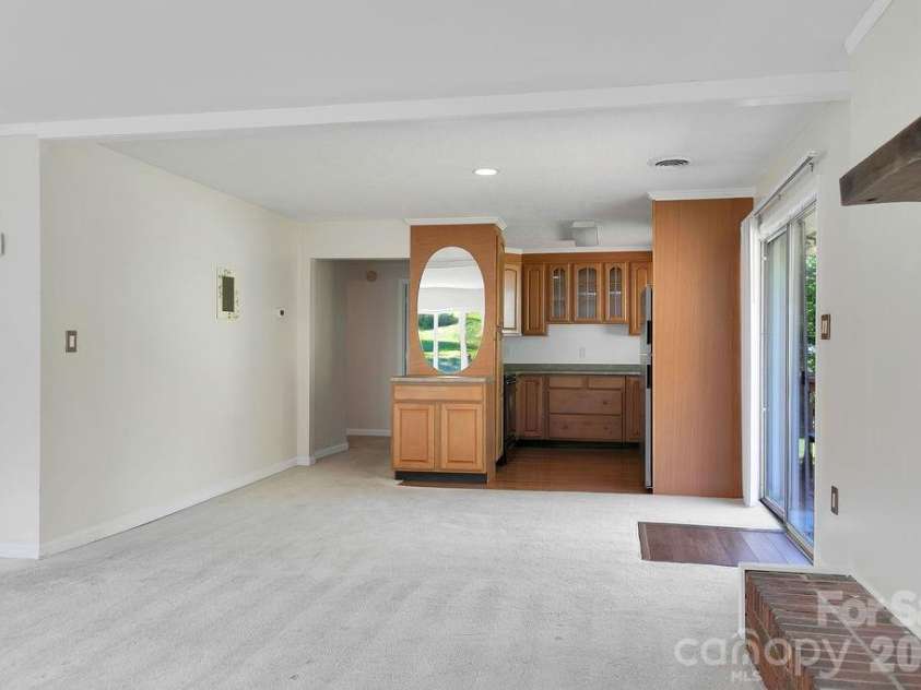 100 Kilpatrick Street, Brevard, NC 28712.  MLS# CAR4382761, YatesRealty ID 35369. Dining room and kitchen