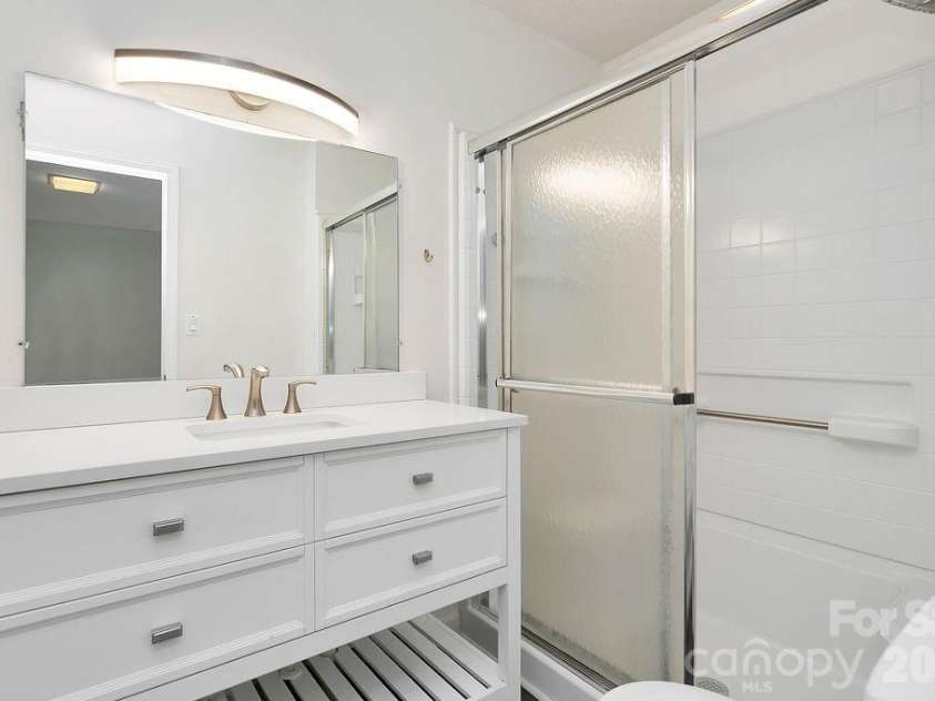 100 Kilpatrick Street, Brevard, NC 28712.  MLS# CAR4382761, YatesRealty ID 35369. Ensuite bath in second bedroom