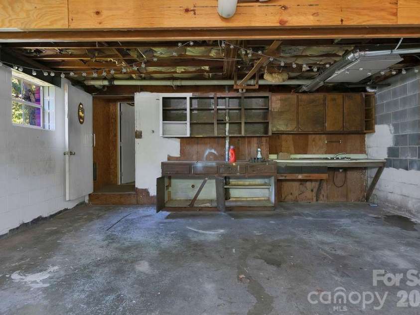100 Kilpatrick Street, Brevard, NC 28712.  MLS# CAR4382761, YatesRealty ID 35369. Garage with storage
