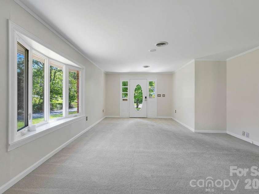 100 Kilpatrick Street, Brevard, NC 28712.  MLS# CAR4382761, YatesRealty ID 35369. Living room