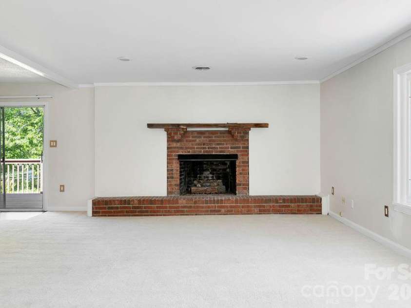100 Kilpatrick Street, Brevard, NC 28712.  MLS# CAR4382761, YatesRealty ID 35369. Living room gas fireplace