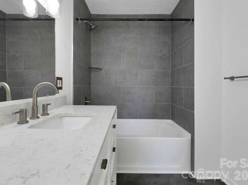 100 Kilpatrick Street, Brevard, NC 28712.  MLS# CAR4382761, YatesRealty ID 35369. Primary bathroom