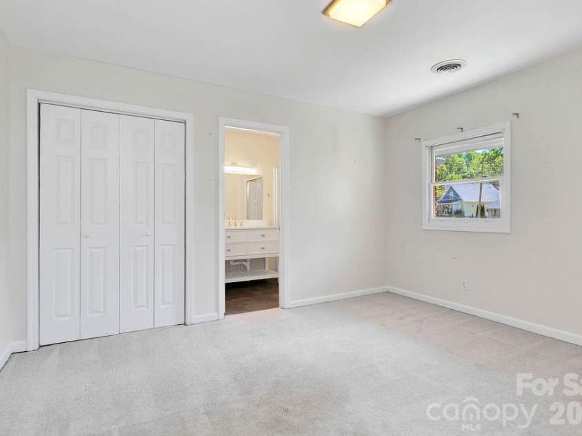 100 Kilpatrick Street, Brevard, NC 28712.  MLS# CAR4382761, YatesRealty ID 35369. Second Bedroom with ensuite bathroom