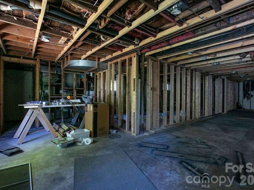 100 Kilpatrick Street, Brevard, NC 28712.  MLS# CAR4382761, YatesRealty ID 35369. Unfinished basement
