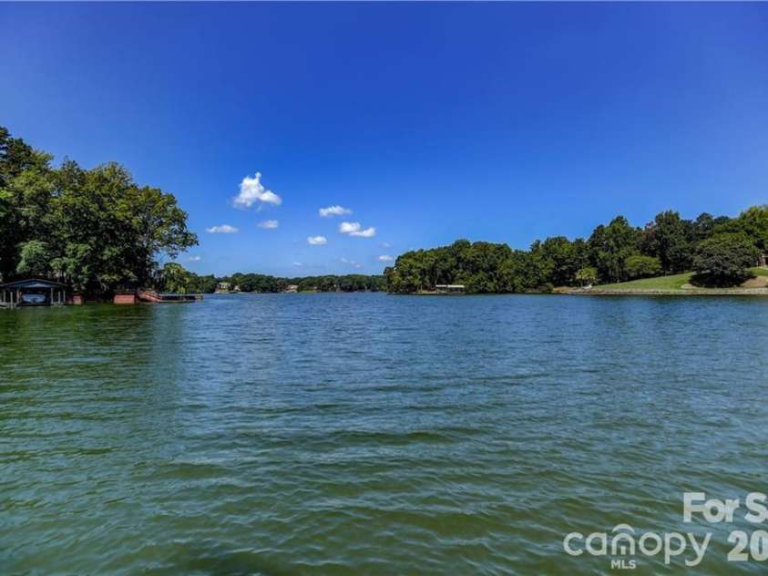 105 Quail Lane, Mooresville, NC 28117.  MLS# CAR4394602, YatesRealty ID 35375. Lake view from back yard