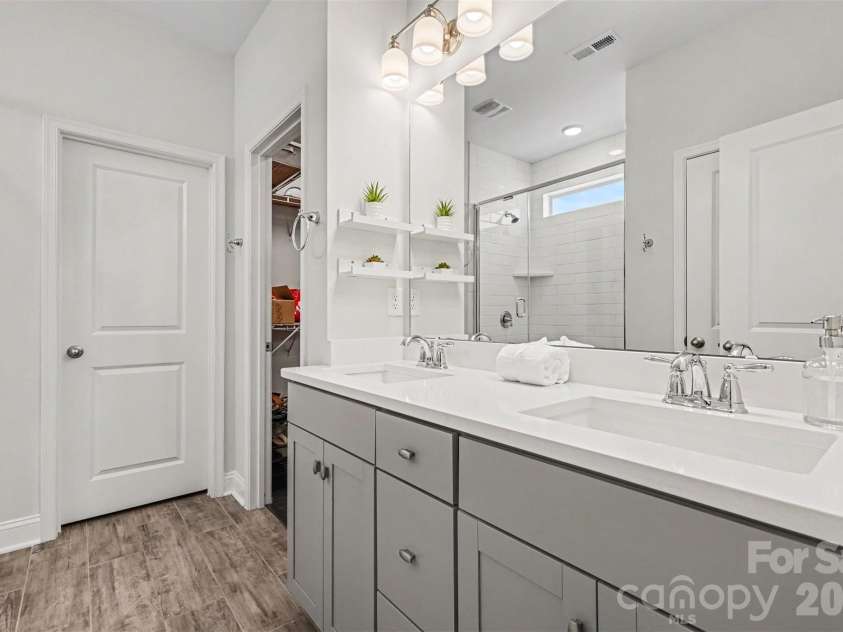 6247 Six String Court, Fort Mill, SC 29708.  MLS# CAR4337495, YatesRealty ID 35379. Primary bathroom with double vanity, large shower and water closet.