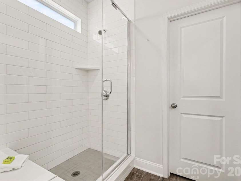 6247 Six String Court, Fort Mill, SC 29708.  MLS# CAR4337495, YatesRealty ID 35379. Primary bathroom with double vanity, large shower and water closet.