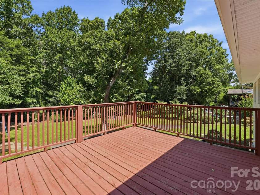 520 Eastway Avenue, Kannapolis, NC 28083.  MLS# CAR4396055, YatesRealty ID 35385. Spacious deck accessed off or primary bedroom and backyard stairwell.