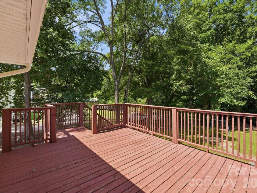 520 Eastway Avenue, Kannapolis, NC 28083.  MLS# CAR4396055, YatesRealty ID 35385. Spacious deck accessed off or primary bedroom and backyard stairwell.