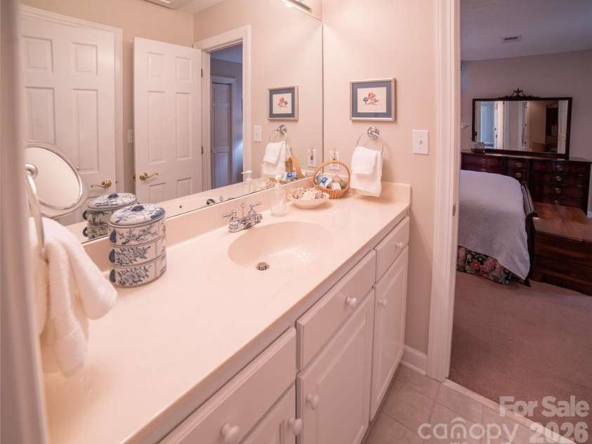 2086 Warrior Fork Trail, Morganton, NC 28655.  MLS# CAR4397825, YatesRealty ID 35399. Oversized vanity has ample counter and storage space for both bedrooms upstairs