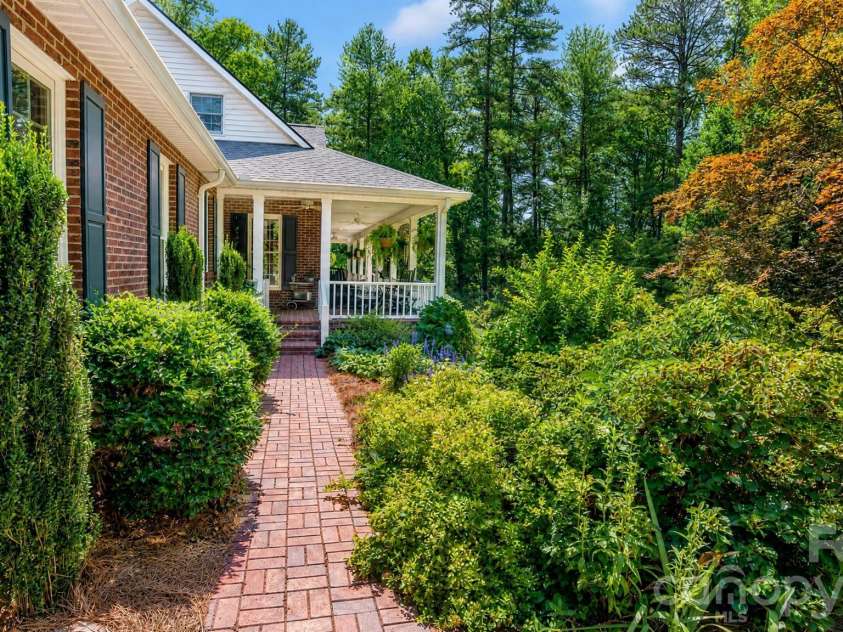 2086 Warrior Fork Trail, Morganton, NC 28655.  MLS# CAR4397825, YatesRealty ID 35399. The afternoon sun on the front of the home