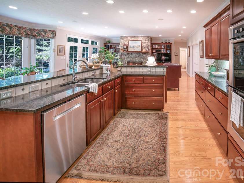 2086 Warrior Fork Trail, Morganton, NC 28655.  MLS# CAR4397825, YatesRealty ID 35399. The gourmet kitchen has fine cherry cabinets and natural surface countertops