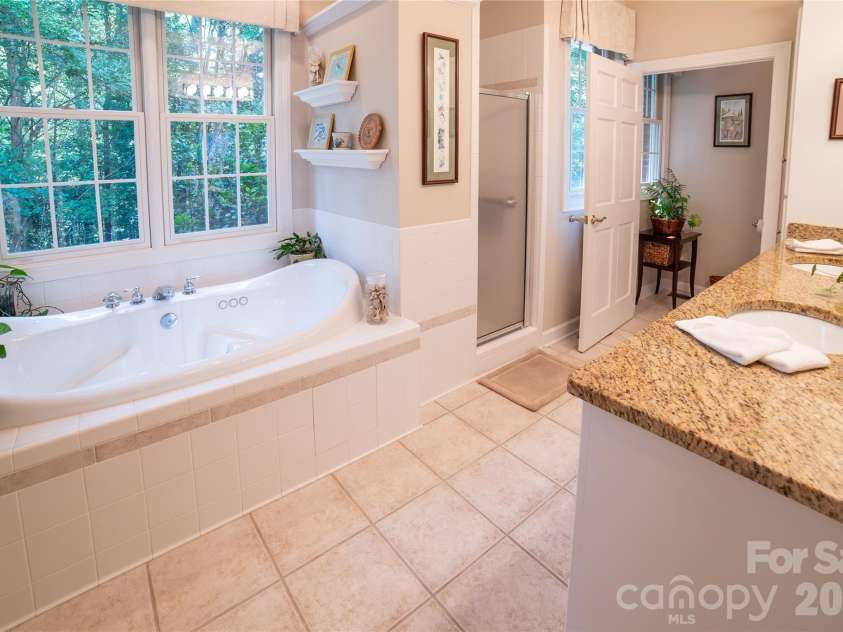 2086 Warrior Fork Trail, Morganton, NC 28655.  MLS# CAR4397825, YatesRealty ID 35399. Watch hummingbirds buzz by while you soak in this jacuzzi tub