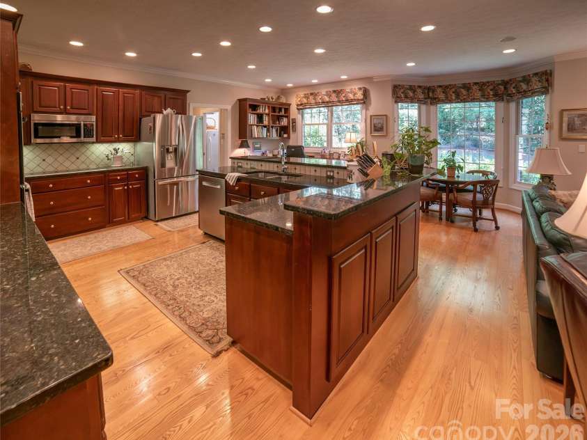 2086 Warrior Fork Trail, Morganton, NC 28655.  MLS# CAR4397825, YatesRealty ID 35399. Well appointed and carefully laid out, the kitchen offers both seating and standing (or service) area along the L-shaped island