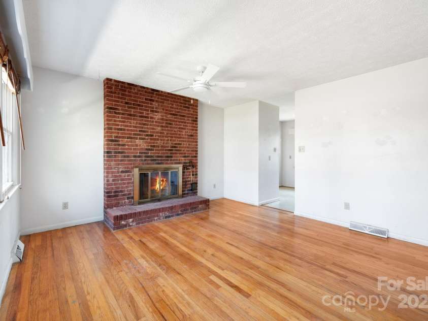101 Arco Road, Asheville, NC 28805.  MLS# CAR4240878, YatesRealty ID 3541. Living Room with Fireplace