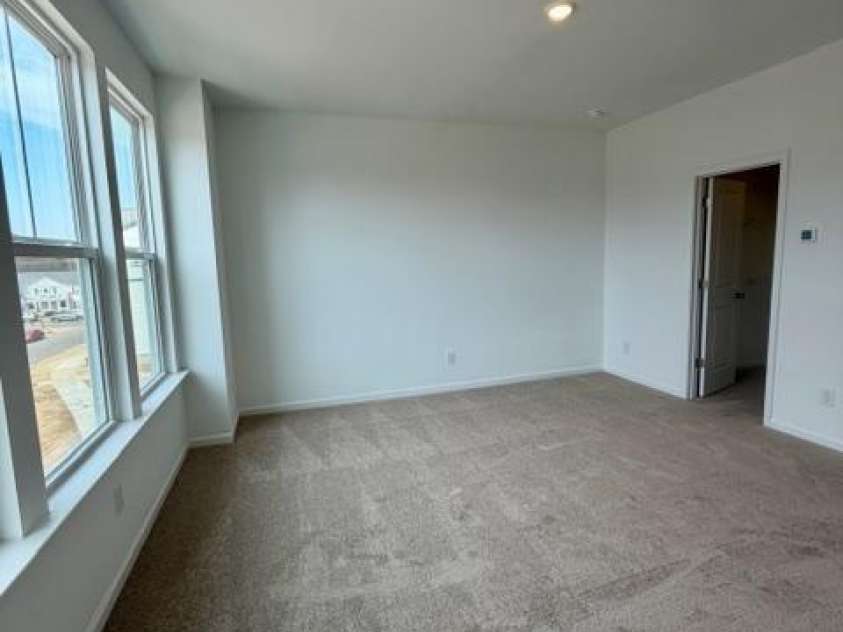 549 Annie Lowery Way, Davidson, NC 28036.  MLS# CAR4353734, YatesRealty ID 3542. Primary bedroom- 3rd level