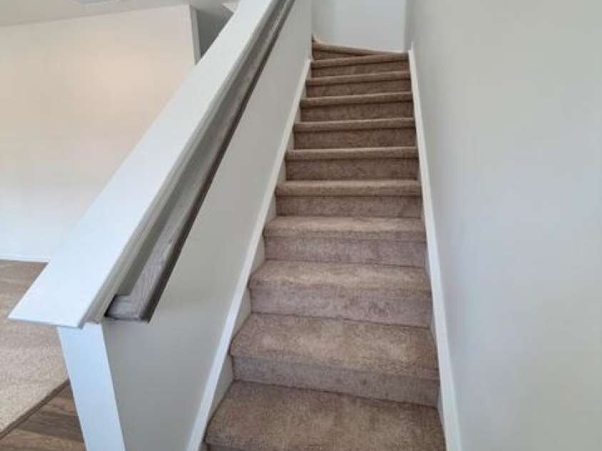 549 Annie Lowery Way, Davidson, NC 28036.  MLS# CAR4353734, YatesRealty ID 3542. Stairs to 2nd level