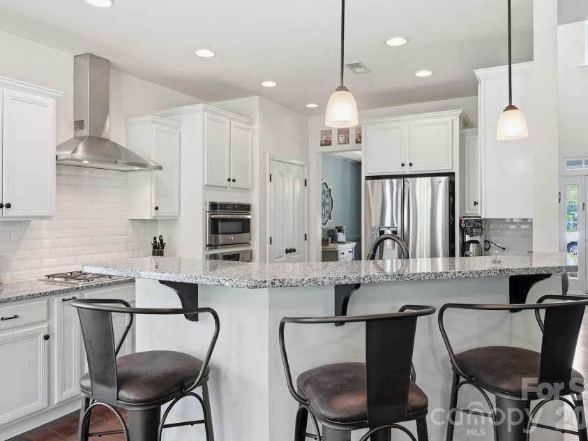 10648 Sky Chase Avenue, Concord, NC 28027.  MLS# CAR4398953, YatesRealty ID 35421. Island Seating