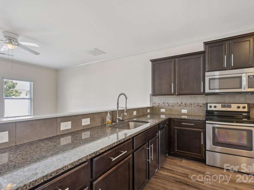 2822 Hopeton Court, Monroe, NC 28110.  MLS# CAR4285934, YatesRealty ID 35422. Kitchen with breakfast bar and plenty of countertop space