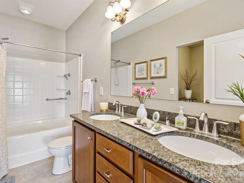 2822 Hopeton Court, Monroe, NC 28110.  MLS# CAR4285934, YatesRealty ID 35422. Virtually staged- primary bathroom