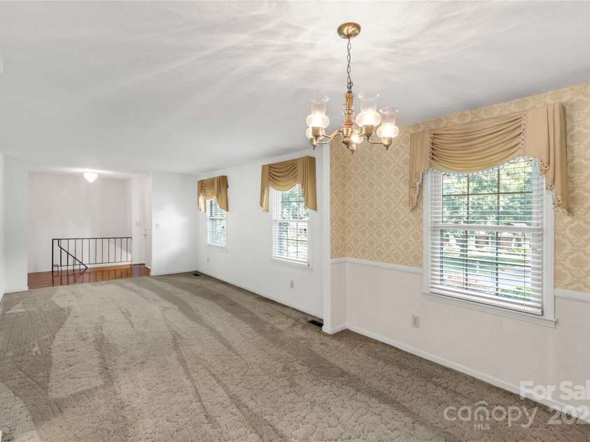 2411 Sandlewood Drive, Gastonia, NC 28054.  MLS# CAR4296248, YatesRealty ID 35438. Dining and Living Room