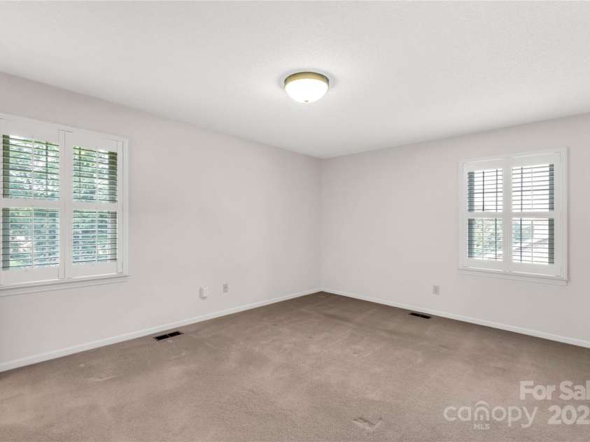 2411 Sandlewood Drive, Gastonia, NC 28054.  MLS# CAR4296248, YatesRealty ID 35438. Primary Bedroom with plantation shutters